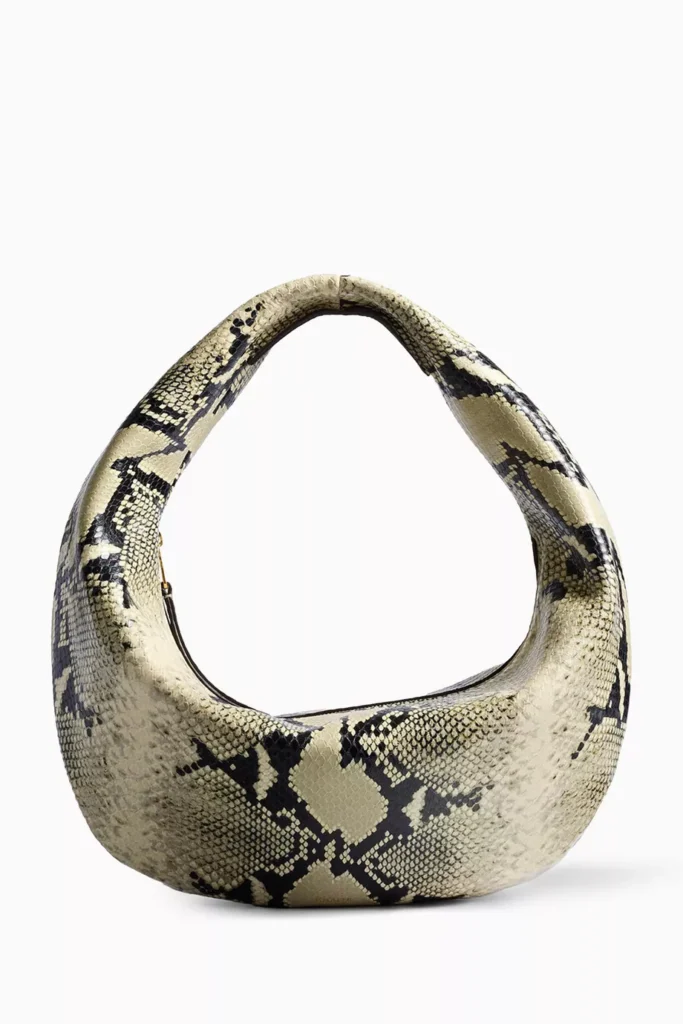 khaite-medium-olivia-hobo-bag-in-python - Soigné Middle East Eid Al Adha 2026 Dressing Guide
