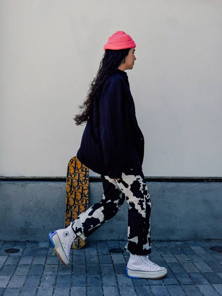 Abisha Safia walking with her skateboard