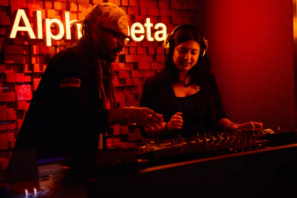 A woman learning how to DJ from AlphaTheta Free DJ Workshop at Dubai’s AlphaTheta Store