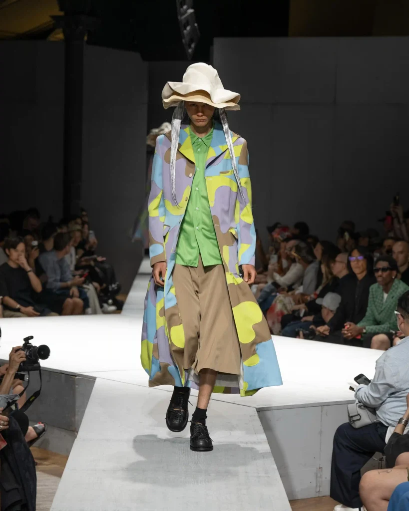 Image of a model walking the COMME des GARÇONS SS27 show, for our Menswear SS27 runway trends roundup