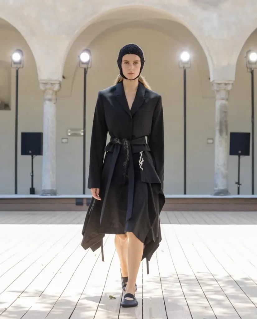 QASIMI-5 - Soigné Middle East A model in an asymmetrical dress walking the runway for QASIMI SS27