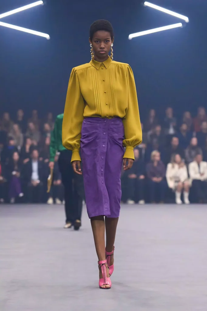 VALENTINO-SS26-mustard-yellow - Soigné Middle East A model walking the Valentino SS26 show for our trend alert: mustard yellow article