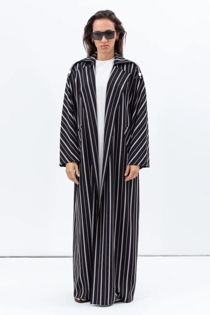 A model image of the Trench Coat Abaya in Stripy Black by Chi-Ka