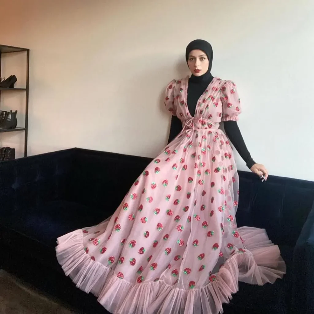 A woman in the Strawberry Dress by  Lirika Matoshi