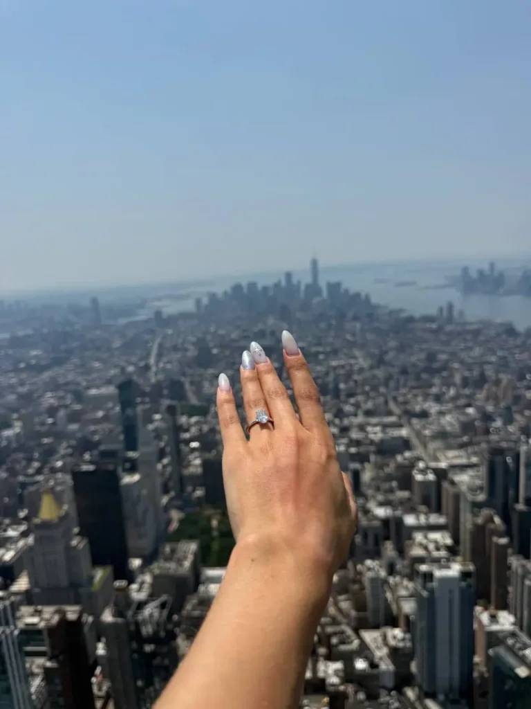 NYC-Climber-Couple-1 - Soigné Middle East Image of Angela Nikolau showing off her engagement ring