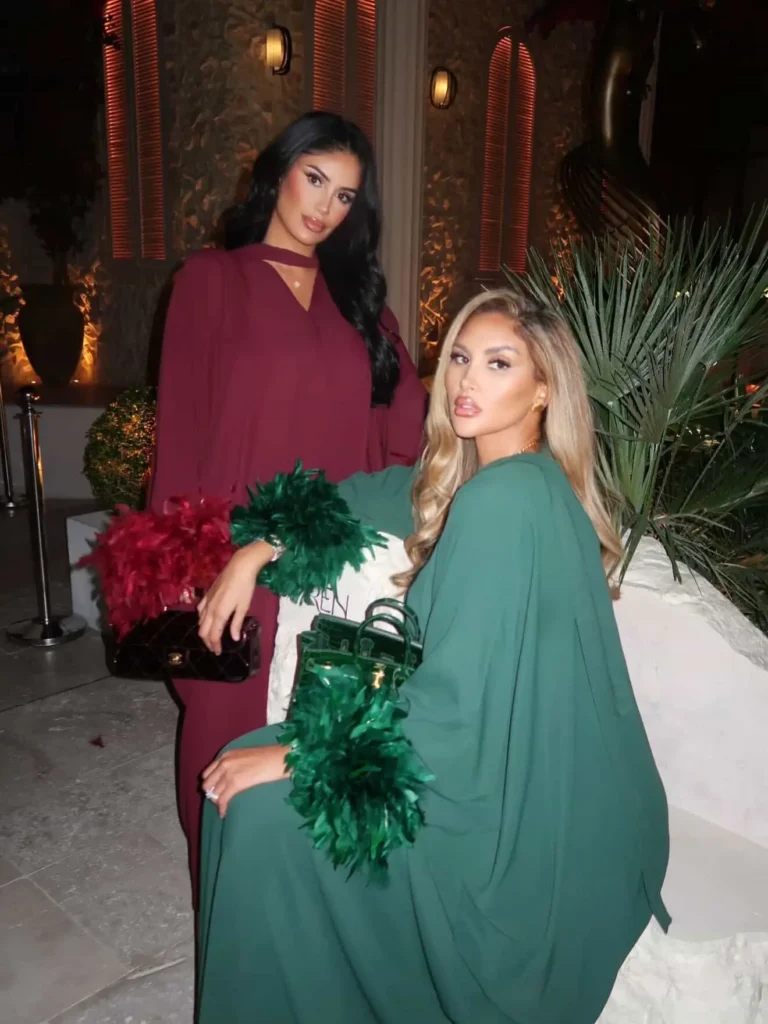 Image of two models wearing abayas from AMK Couture