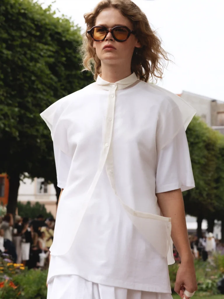 image of a model walking the MKDT Studio SS27 show in sheer fashion