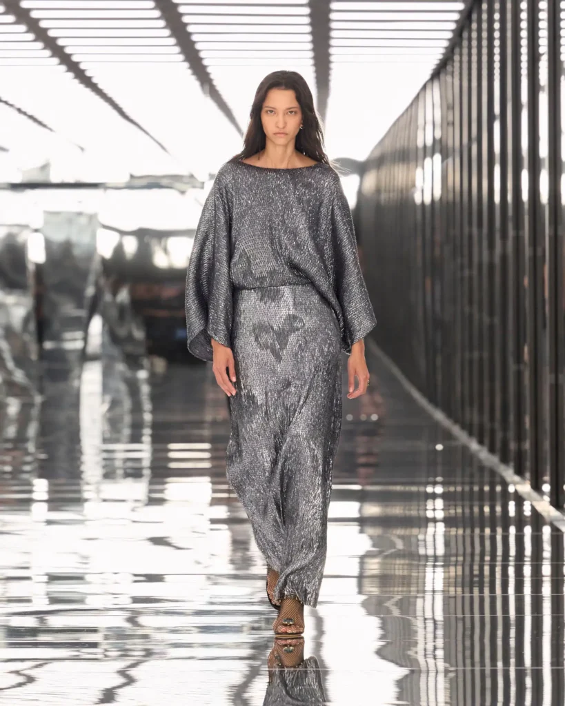 A model walking the Fendi SS27 runway